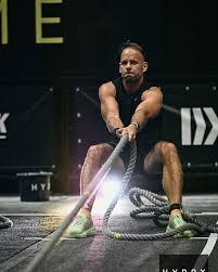 Neil training with battle ropes at a Hyrox event